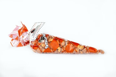 7 ounces of fresh roasted cinnamon glazed cashews inside a red and clear Totally Nutz polycone bag